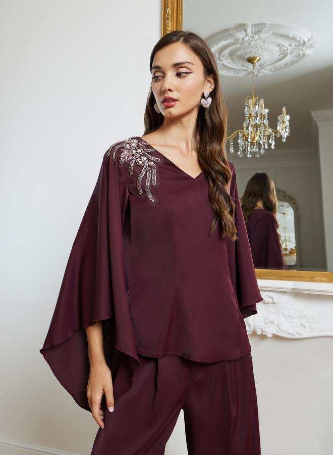 ستايلي طقم منسق من بنطال بأرجل واسعة وبلوزة منمقة - Image 1